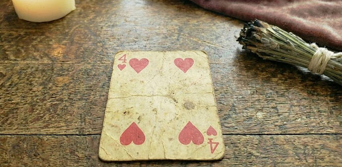 4 of hearts tarot meaning